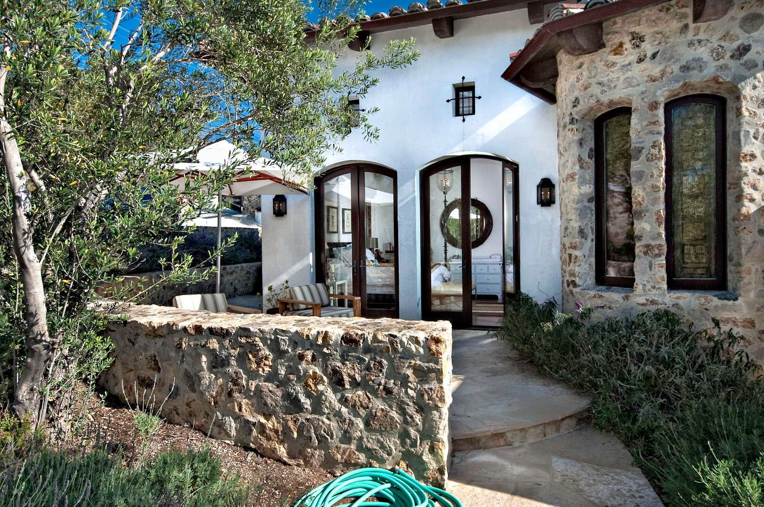 A house with a hose in front of it.