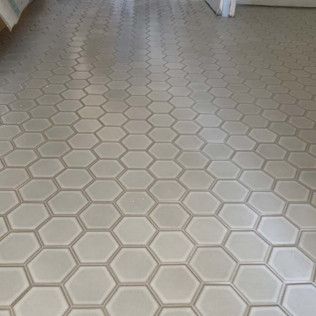 Light gray hexagonal tile floor.