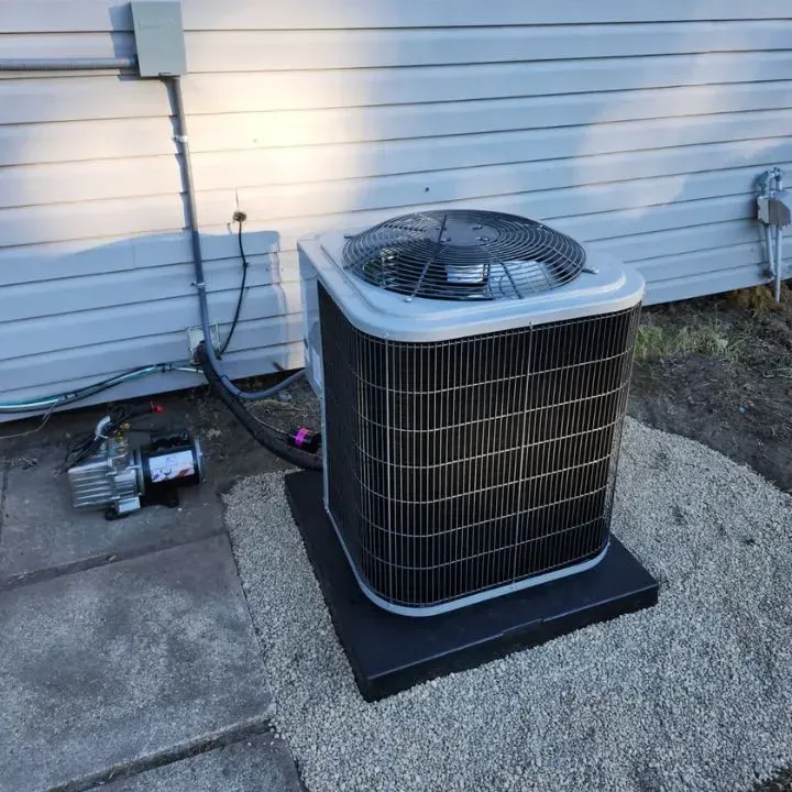 Licensed HVAC technician discussing AC installation benefits with homeowner