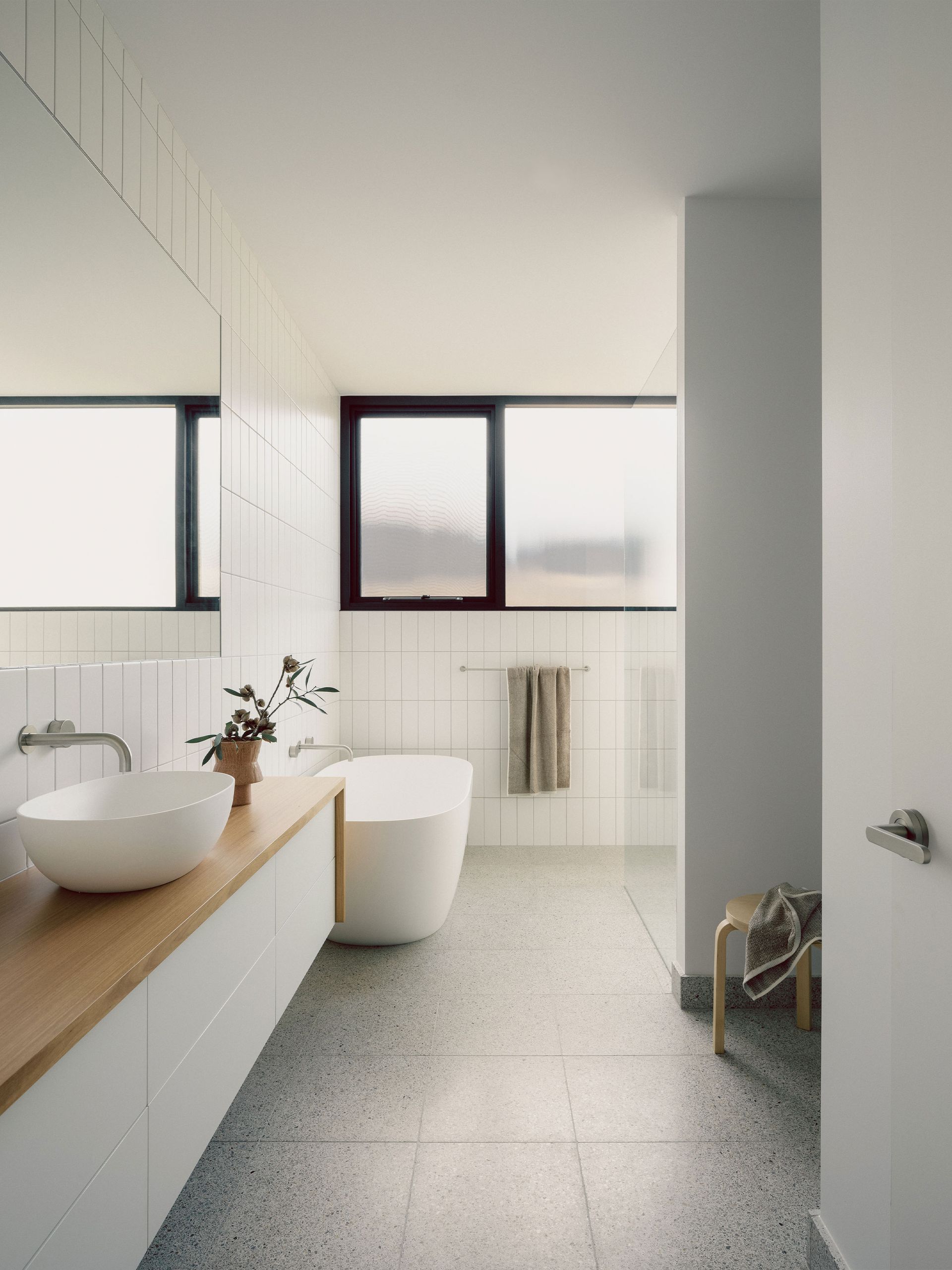 A large house is being built with a crane in front of it