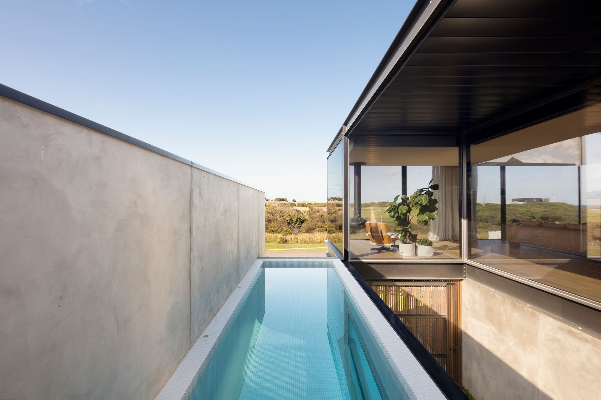 There is a swimming pool in the middle of the house.