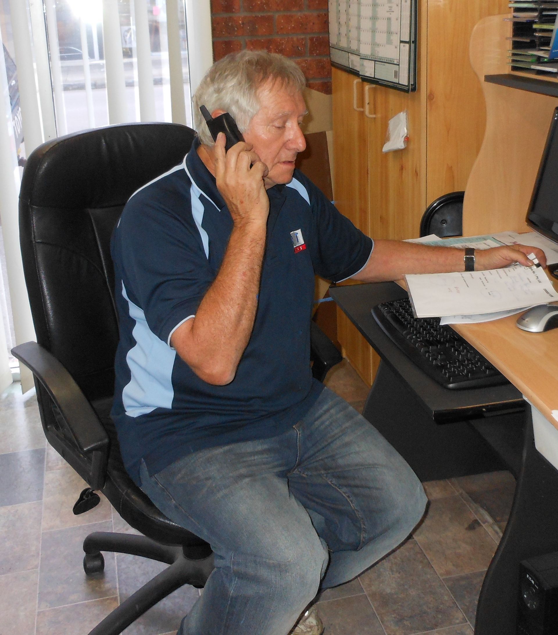 A machine is cutting a metal pipe with sparks coming out of it.