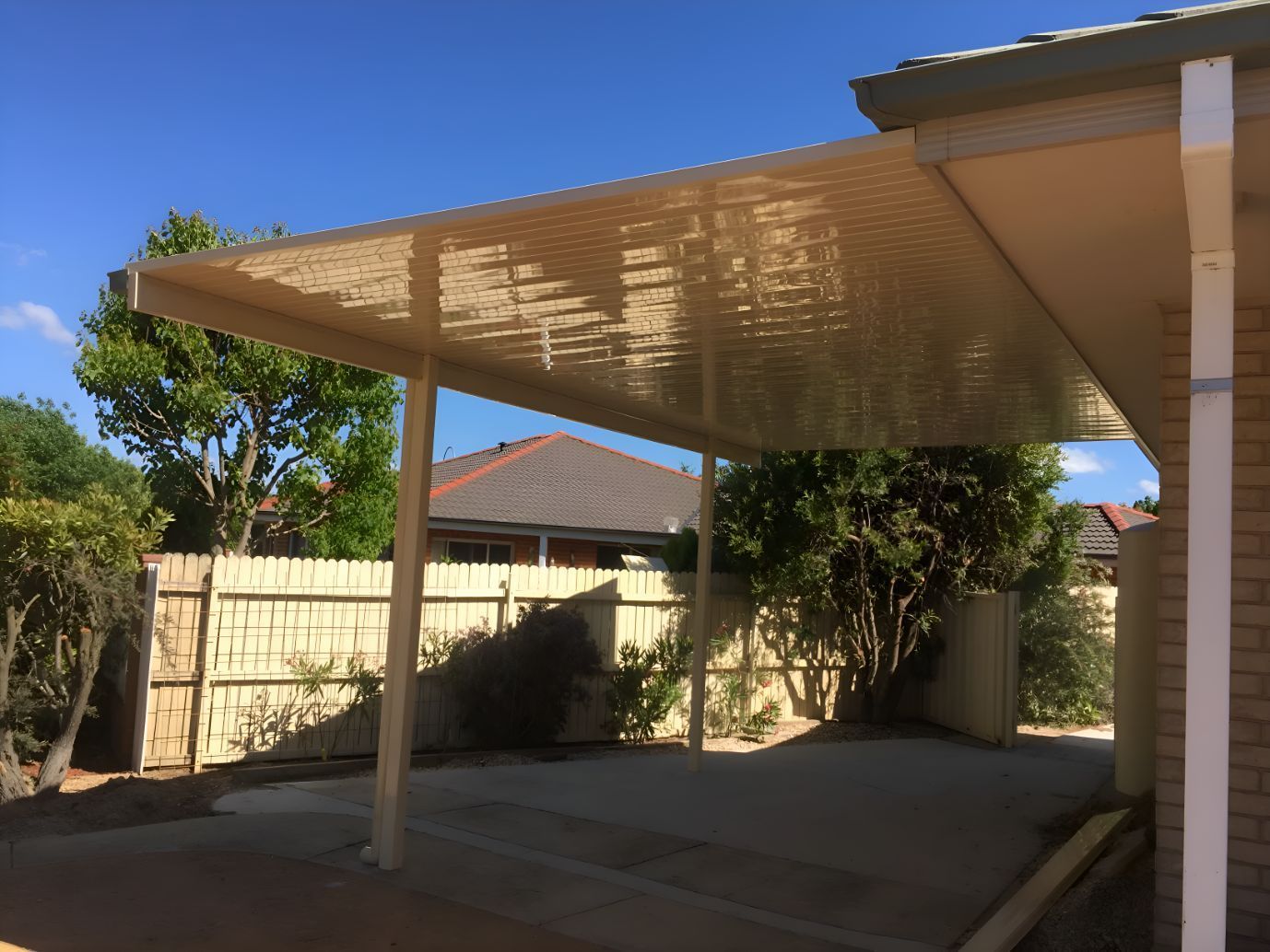 A house with a carport in front of it - All Top Roofing In Canberra, ACT