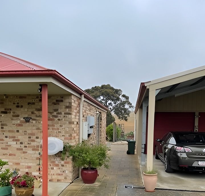 The Roof Of A House Is Being Built With Wooden Beams — All Top Roofing In Royalla, NSW