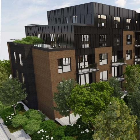 Un grand bâtiment avec beaucoup de fenêtres et de balcons