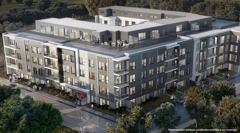 Une vue aérienne d'un grand immeuble entouré d'arbres.