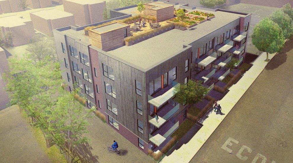 Une vue aérienne d'un grand immeuble avec un jardin sur le toit.