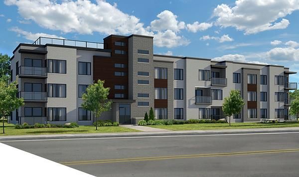 Une vue d'artiste d'un grand immeuble d'appartements.