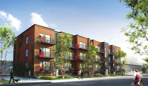 Vue d'artiste d'un immeuble d'appartements en brique avec balcons.