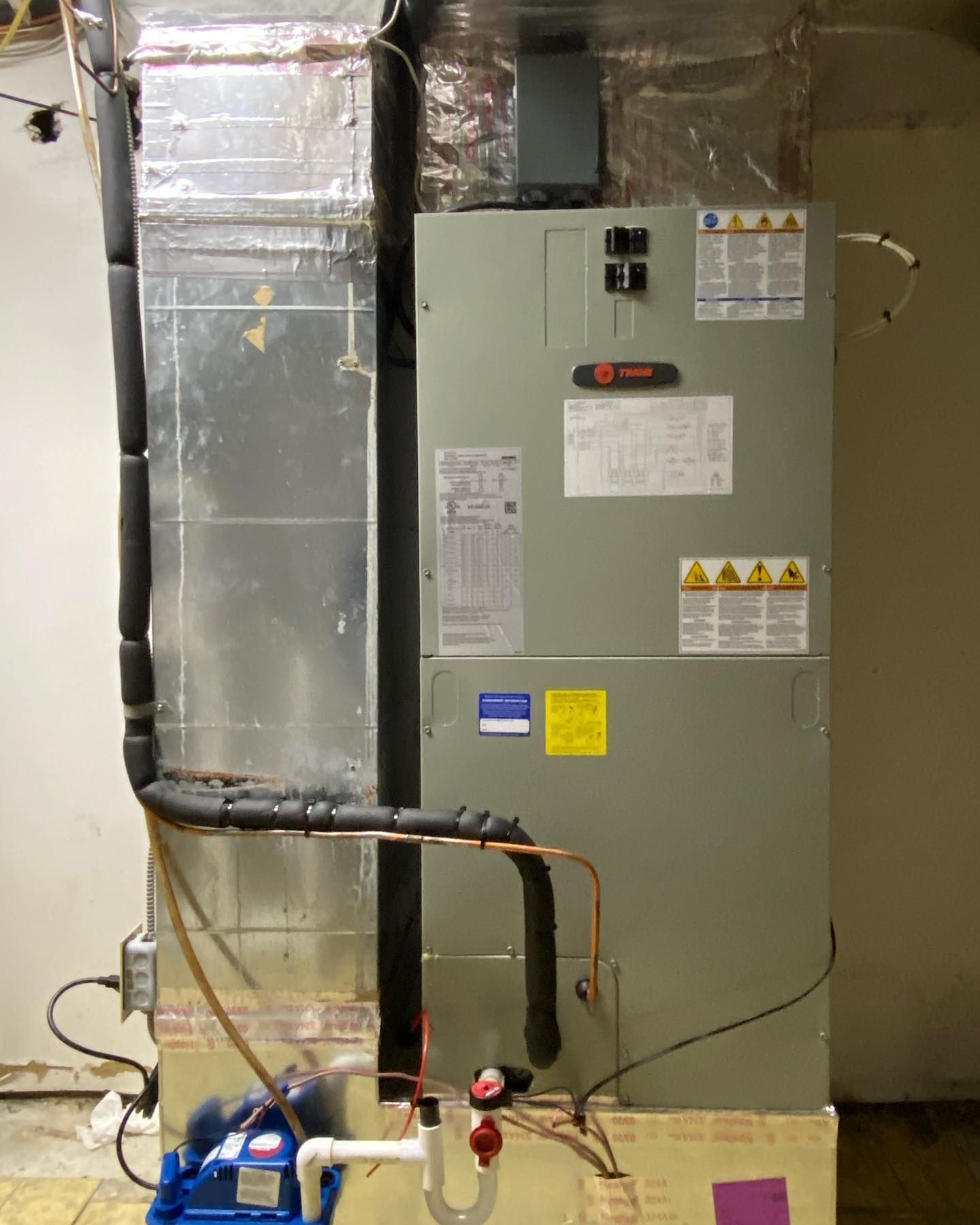 An air conditioner with a warning label on it