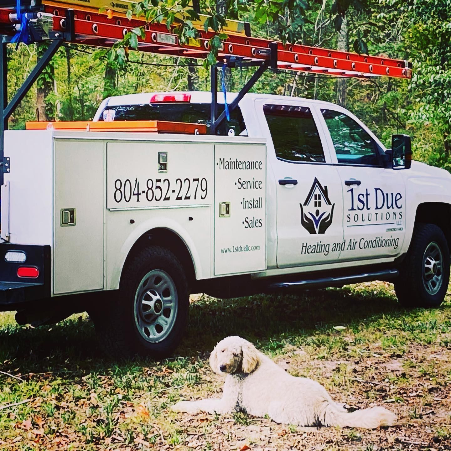 A white truck with 1st due solutions written on the side