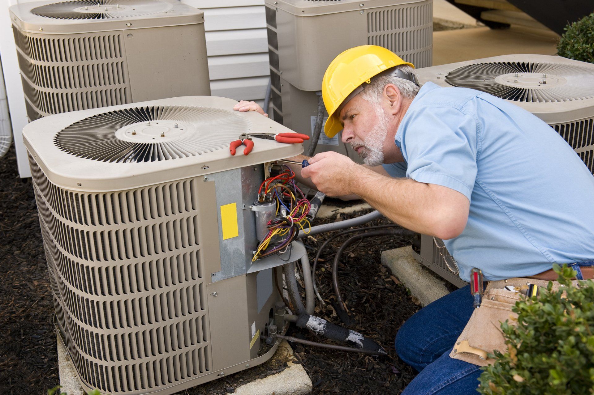 Man Repairing  Central HVAC — Green Bay, WI — AnSer