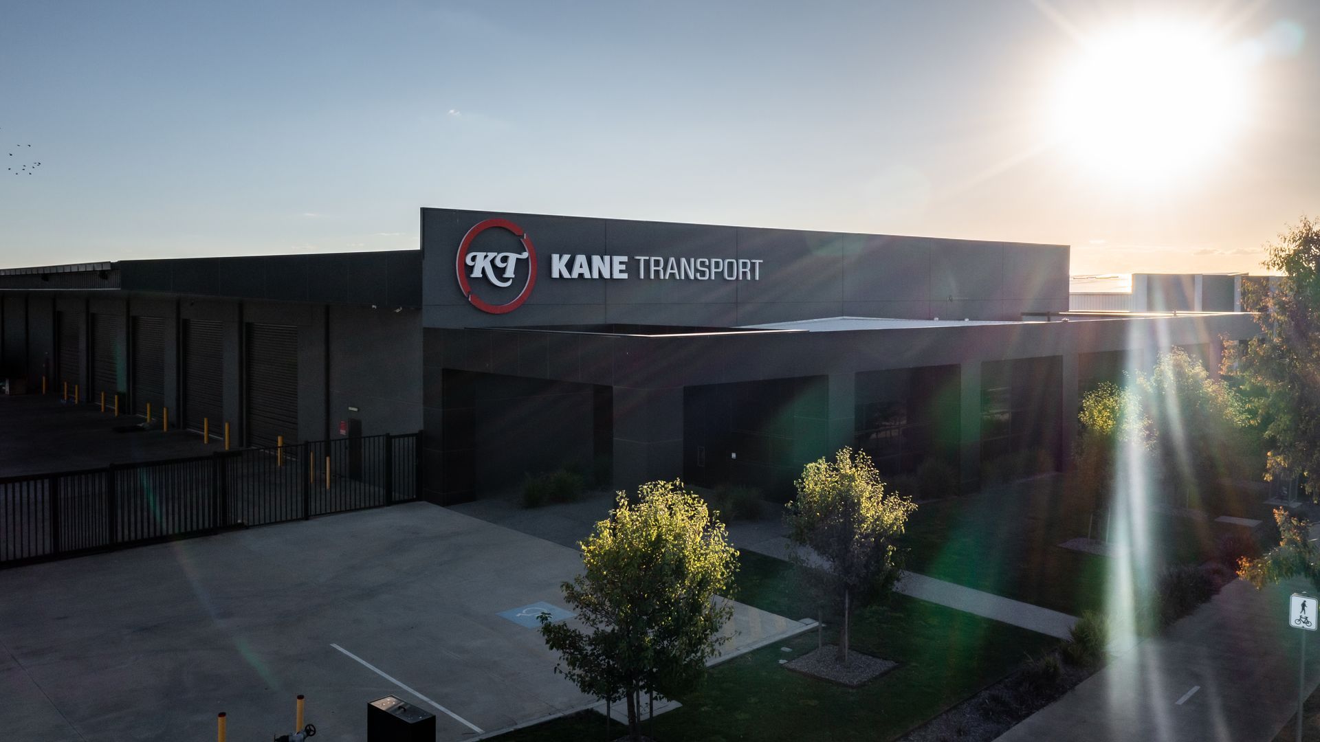 An aerial view of Kane Transport with the sun shining through the windows.