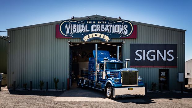 A blue semi truck branded by PSVC