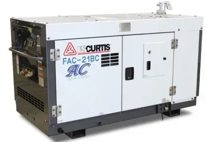A curtis ac generator is sitting on a white surface.