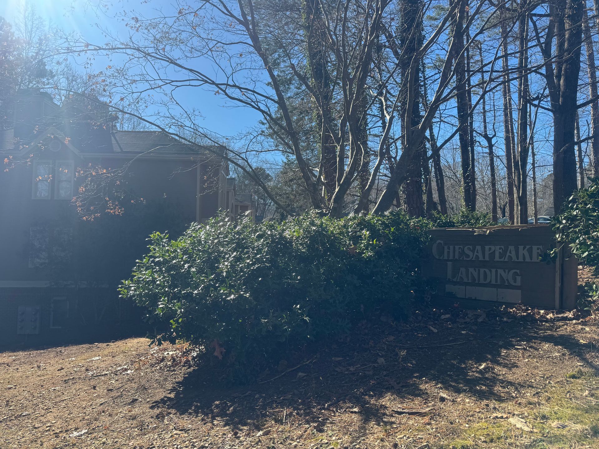 A brown wooden sign reading 