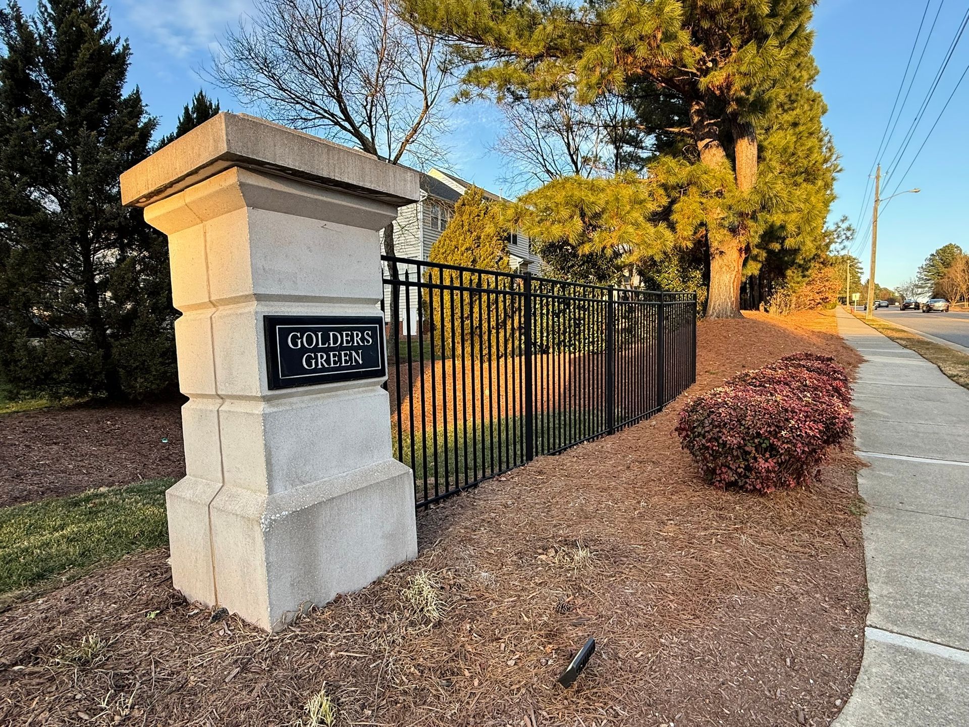 A stone pillar with a black 