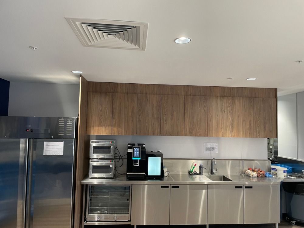 Carpenter Working With Apprentice In Joinery Workshop — Prime Edge Joinery Pty Ltd in Flinders, NSW