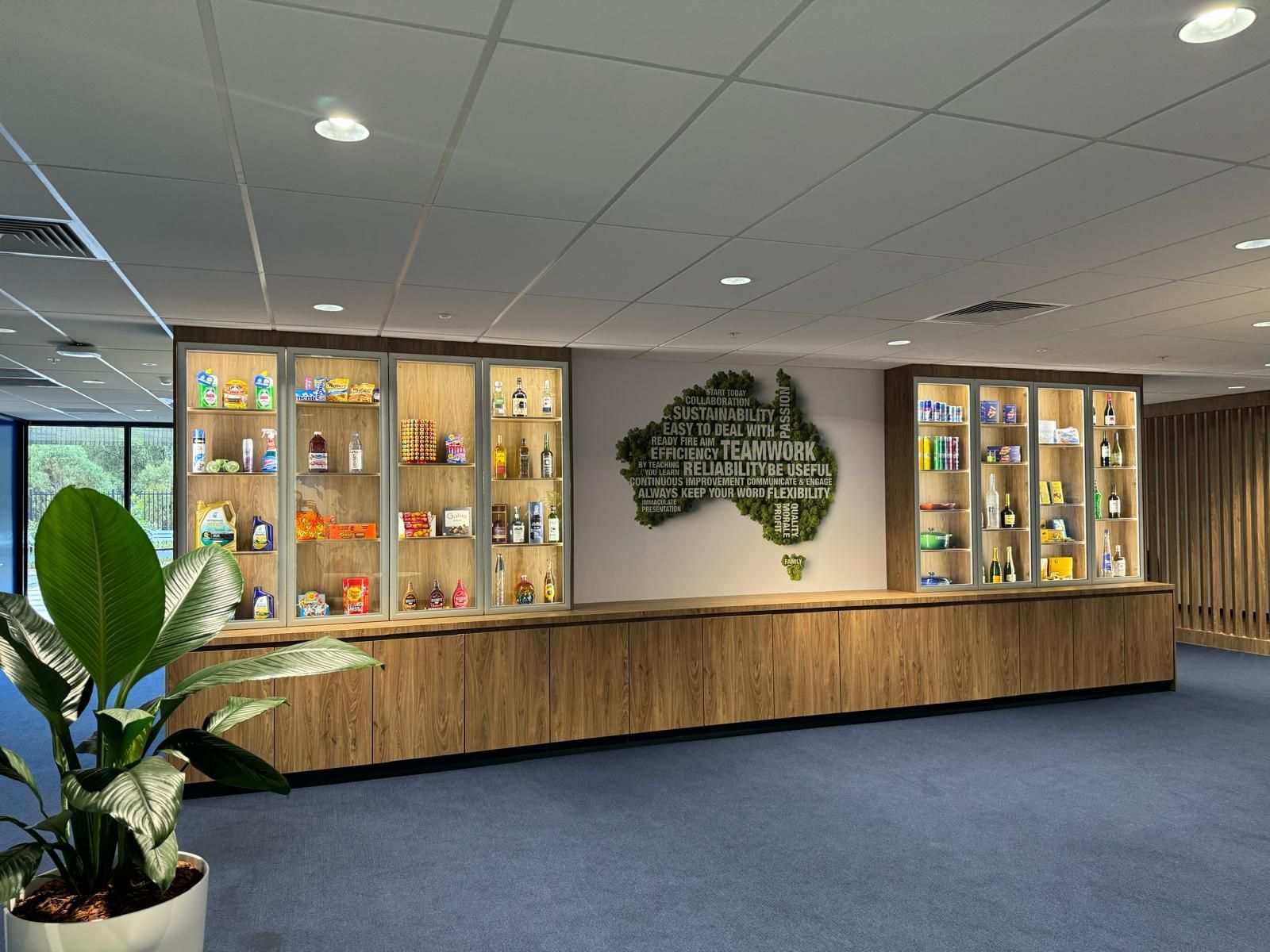 The Carpenter Puts The Kitchen Working Surface In Place — Prime Edge Joinery Pty Ltd in Flinders, NSW