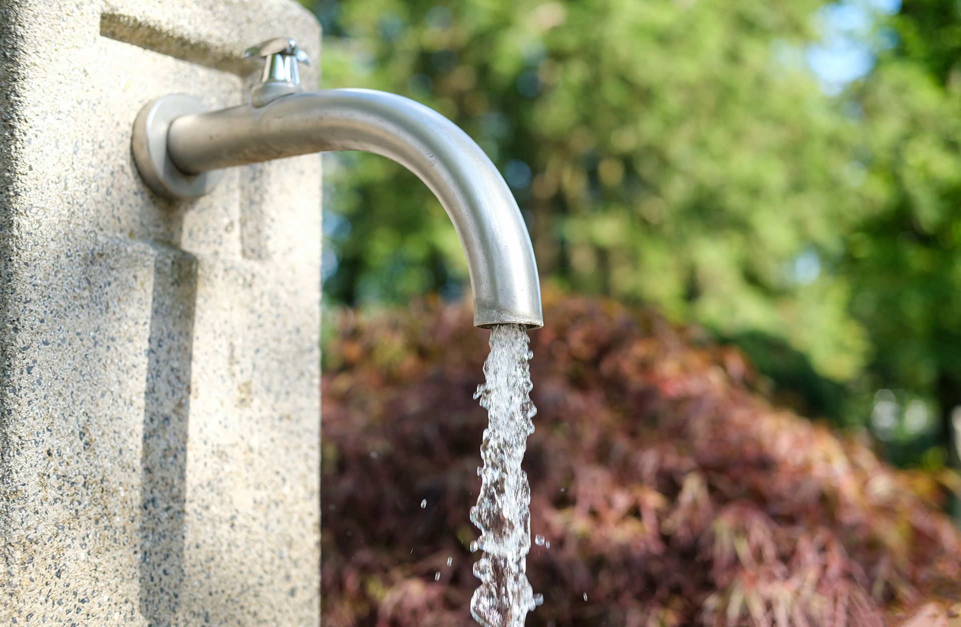 A faucet is turned on and water is coming out of it
