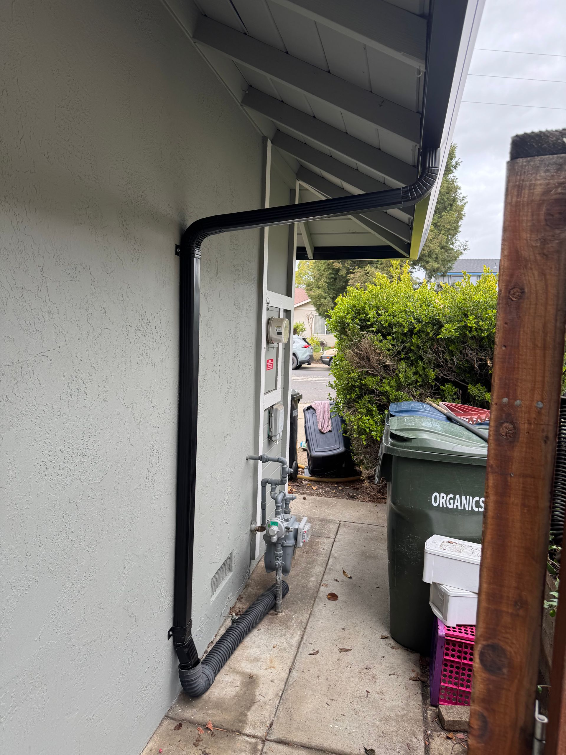 dark gutter downspout