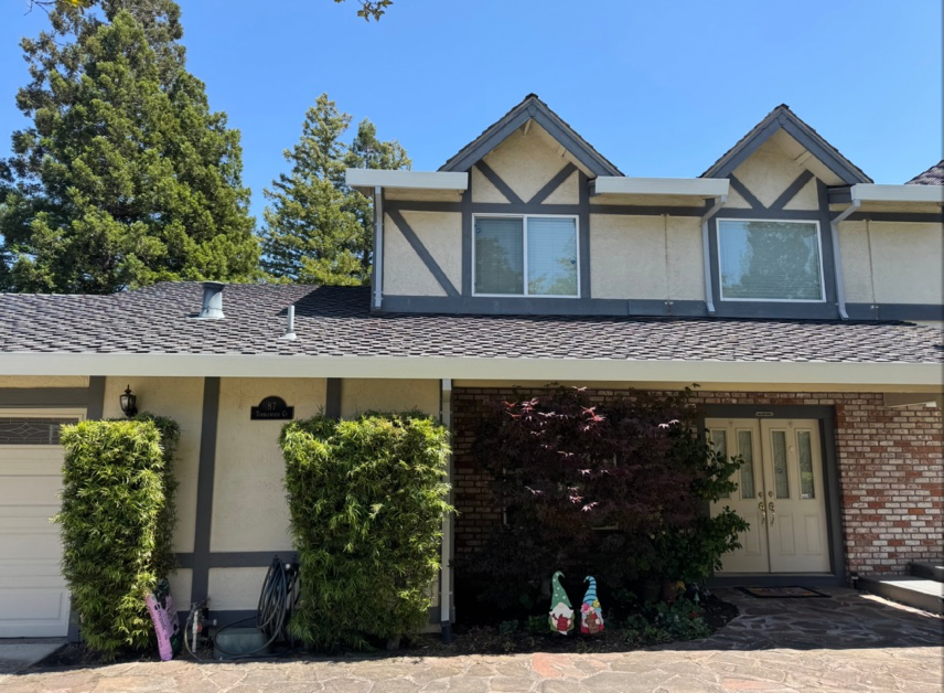 linen gutters with dark downspout