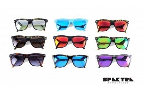 a bunch of different colored sunglasses on a white background