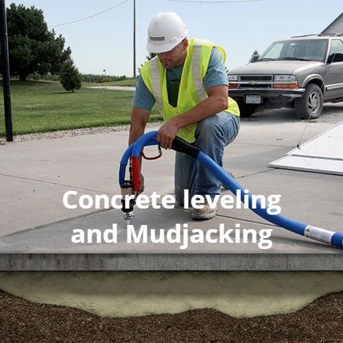 A professional concrete contractor using specialized equipment to lift and level a sunken concrete slab through concrete leveling technique.