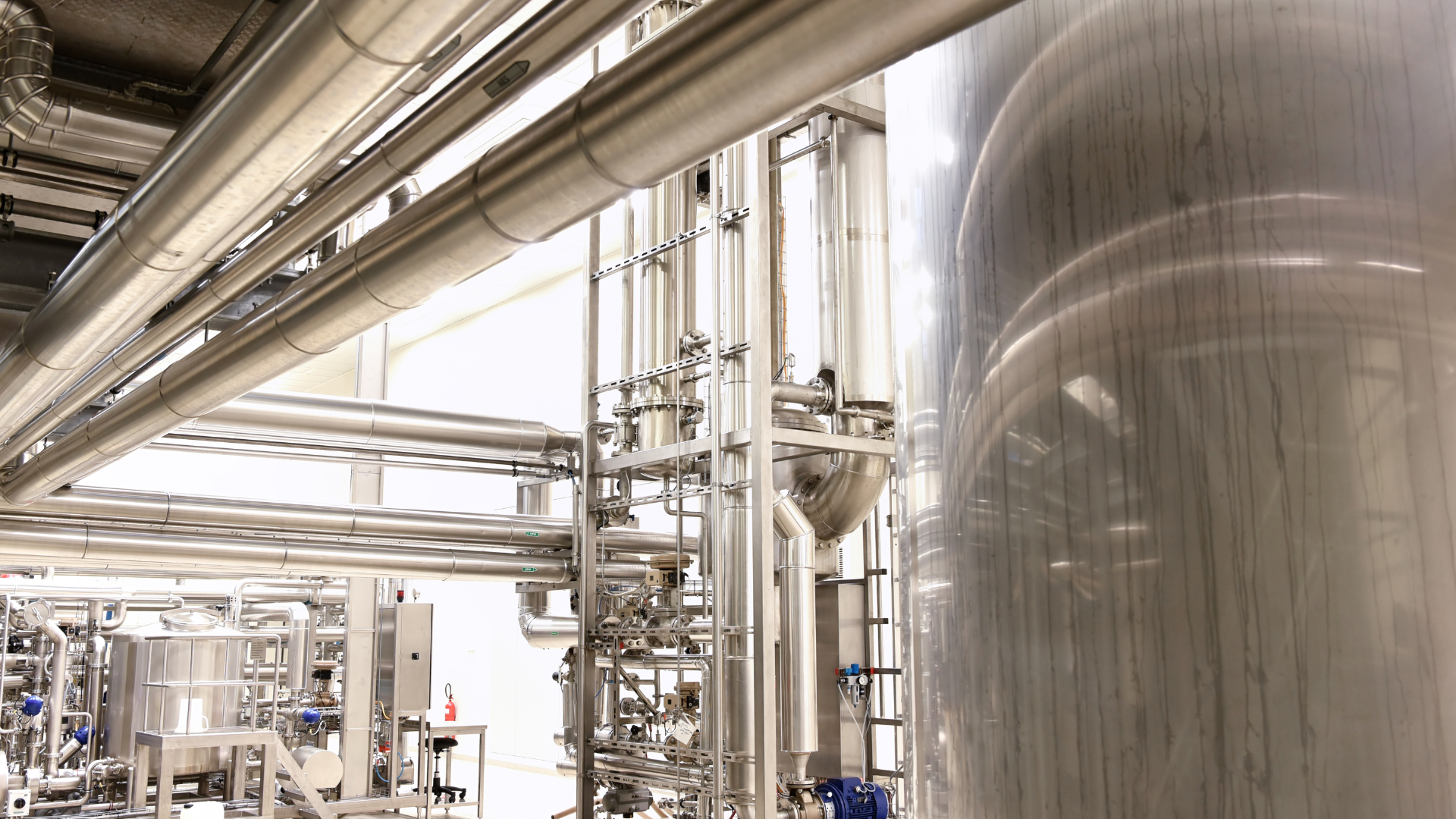 A factory filled with lots of pipes and tubes.