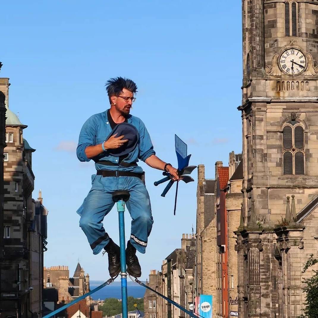 Malachi Frost performing his circus act on a high pole