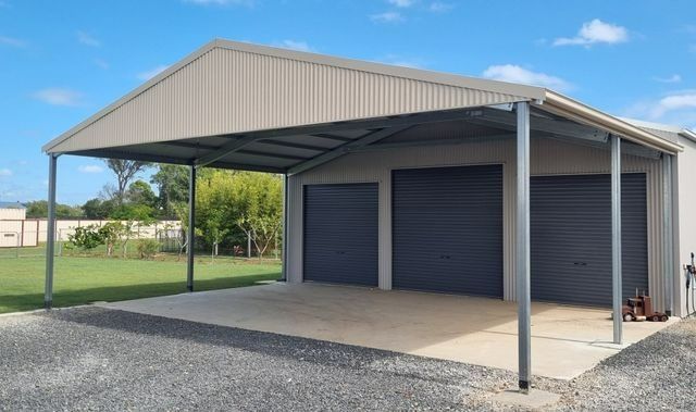 A Garage with A Canopy Over It and Two Garage Doors — All Steel Homes in Branyan, QLD