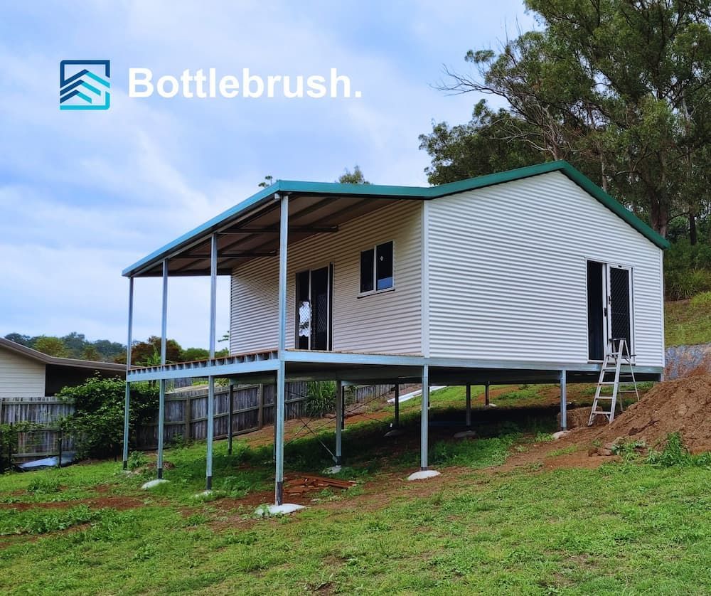A White House with A Green Roof — All Steel Homes in Branyan, QLD