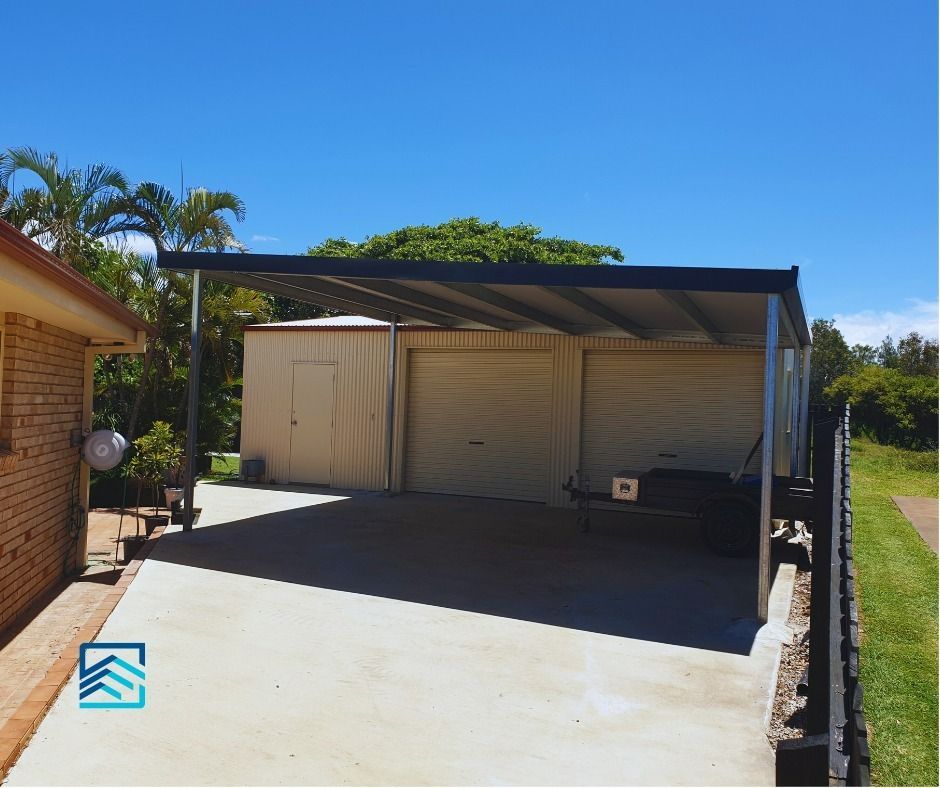 A Brick House with A Carport in Front of It — All Steel Homes in Branyan, QLD