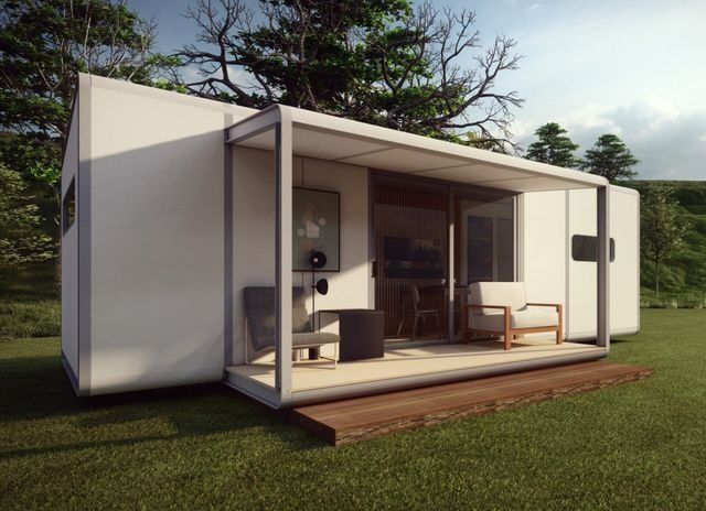 A Small White House with A Porch and Chairs — All Steel Homes in Branyan, QLD