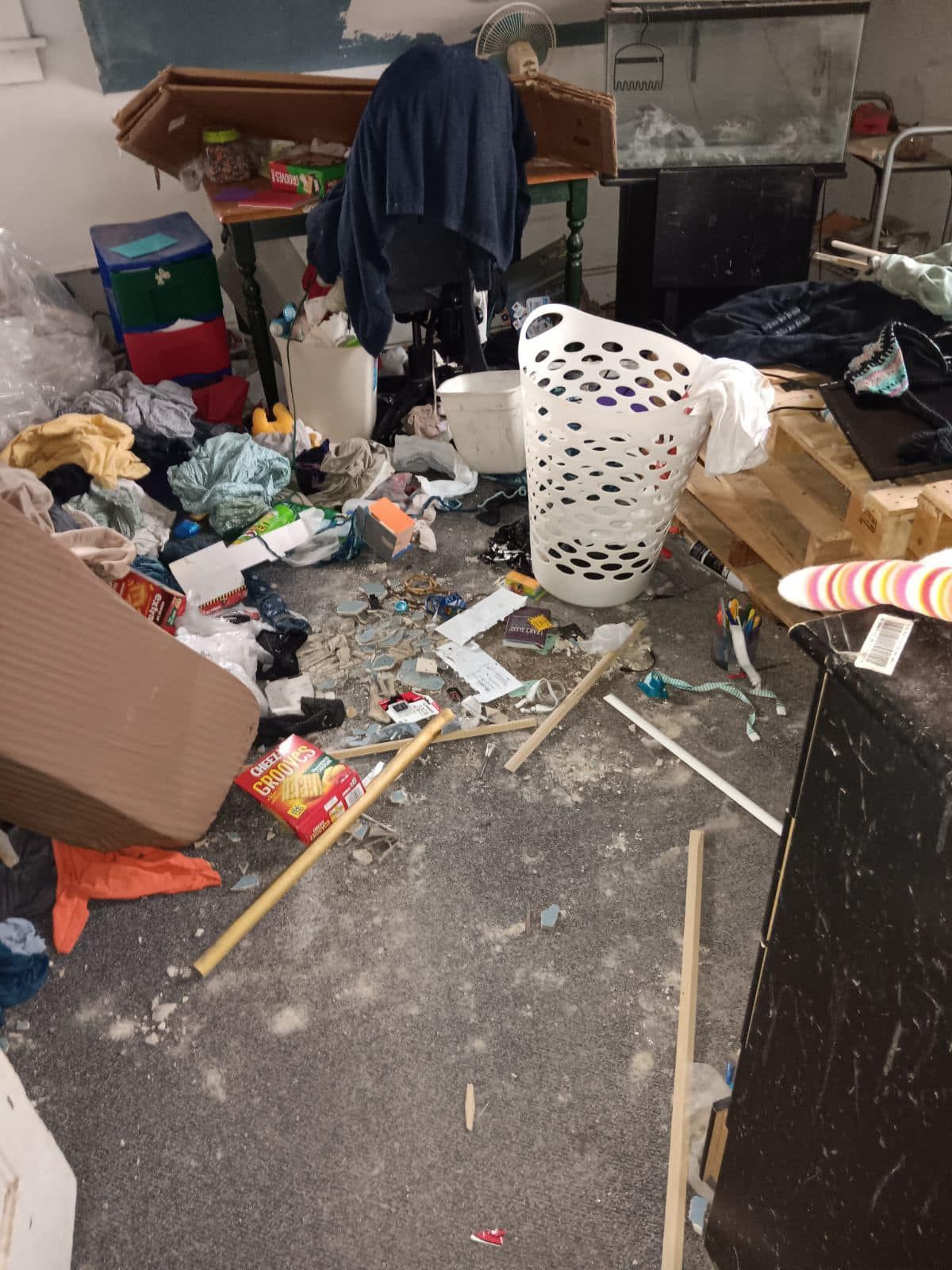 room full with residential  junk on  floor