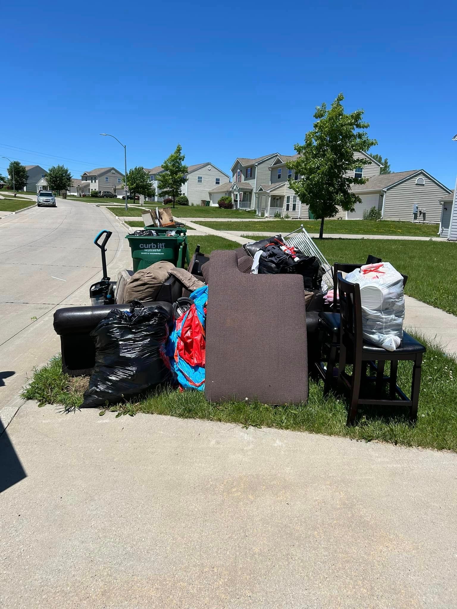 residential junk in front house near street