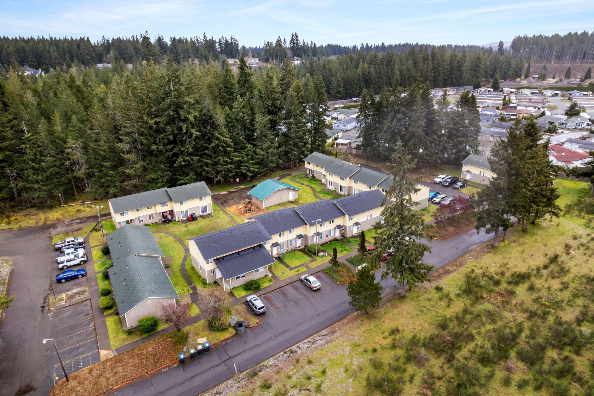 An aerial view of a residential area with lots of buildings and trees.