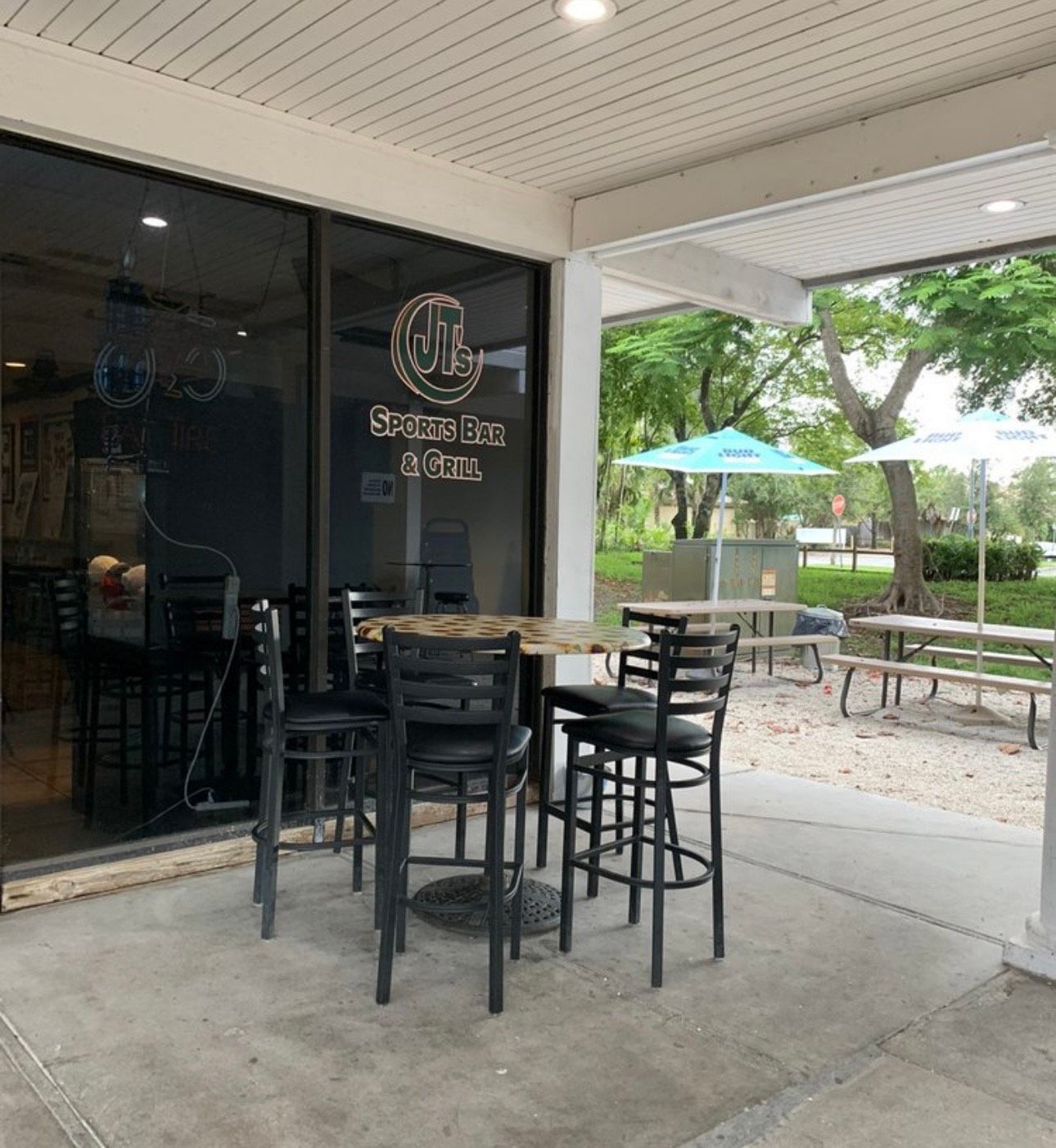 A patio with tables and chairs outside of a restaurant