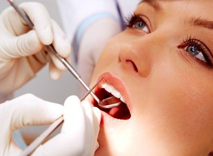 Dentist Examining the Patient's Teeth — Parma, OH — Family Dental Care