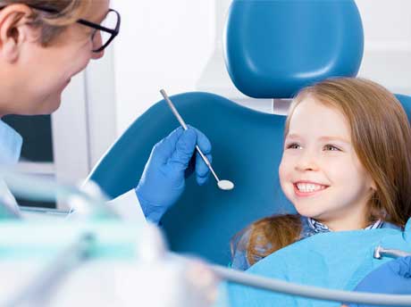 Dentist Checking Girl's Teeth — Parma, OH — Family Dental Care