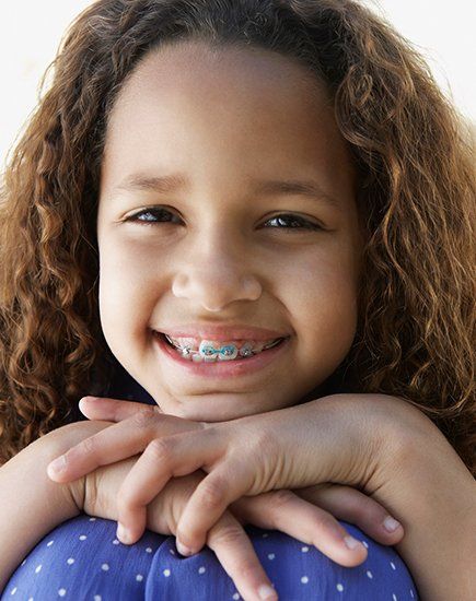 Happy Kid Wearing Dental Braces — Parma, OH — Family Dental Care
