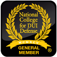 Black and gold emblem for National College for DUI Defense: laurel wreath, text, and 
