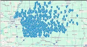 A map centered on Peoria, Illinois, showing a dense cluster of blue location pins across a surrounding rural area.