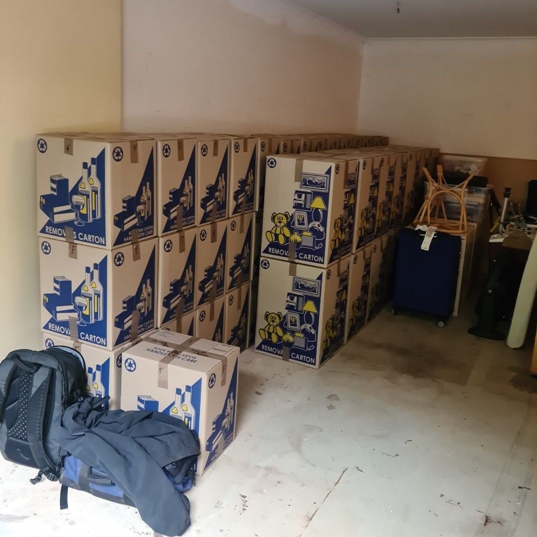 Boxes Stacked in a Room, Likely for Moving — John's Furniture Removals in Yandina, QLD