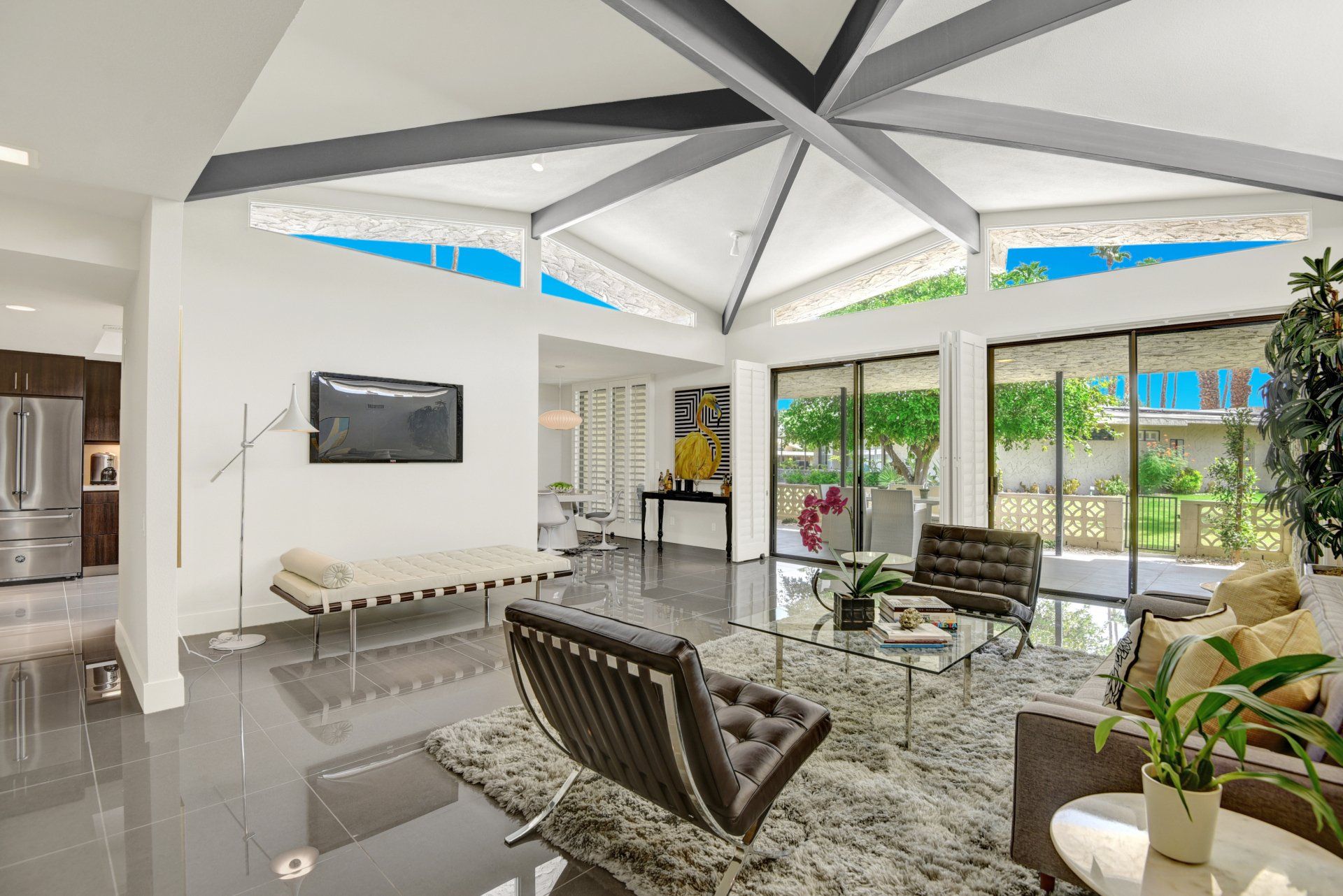 A living room filled with furniture and a flat screen tv.