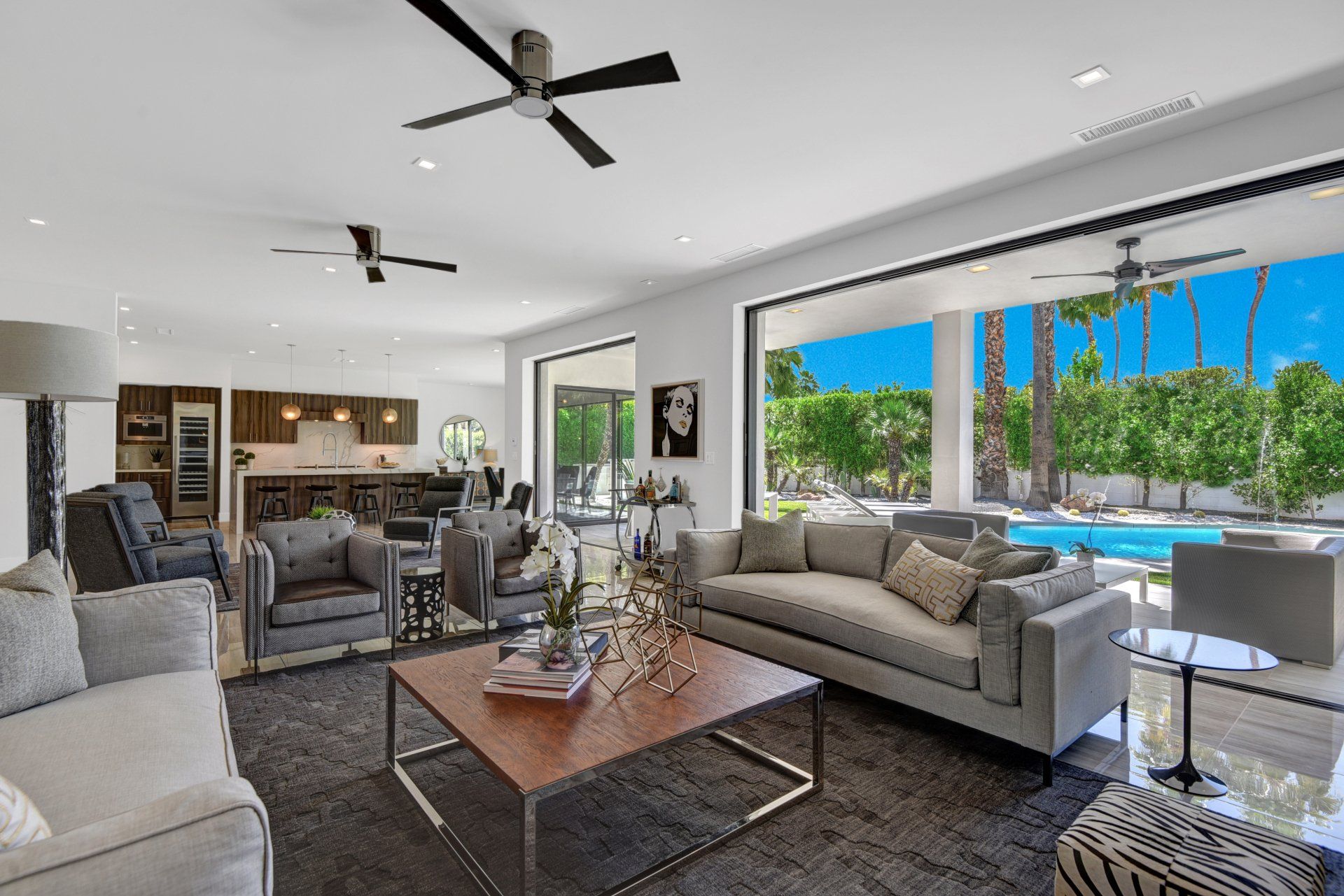 A living room filled with furniture and a ceiling fan.