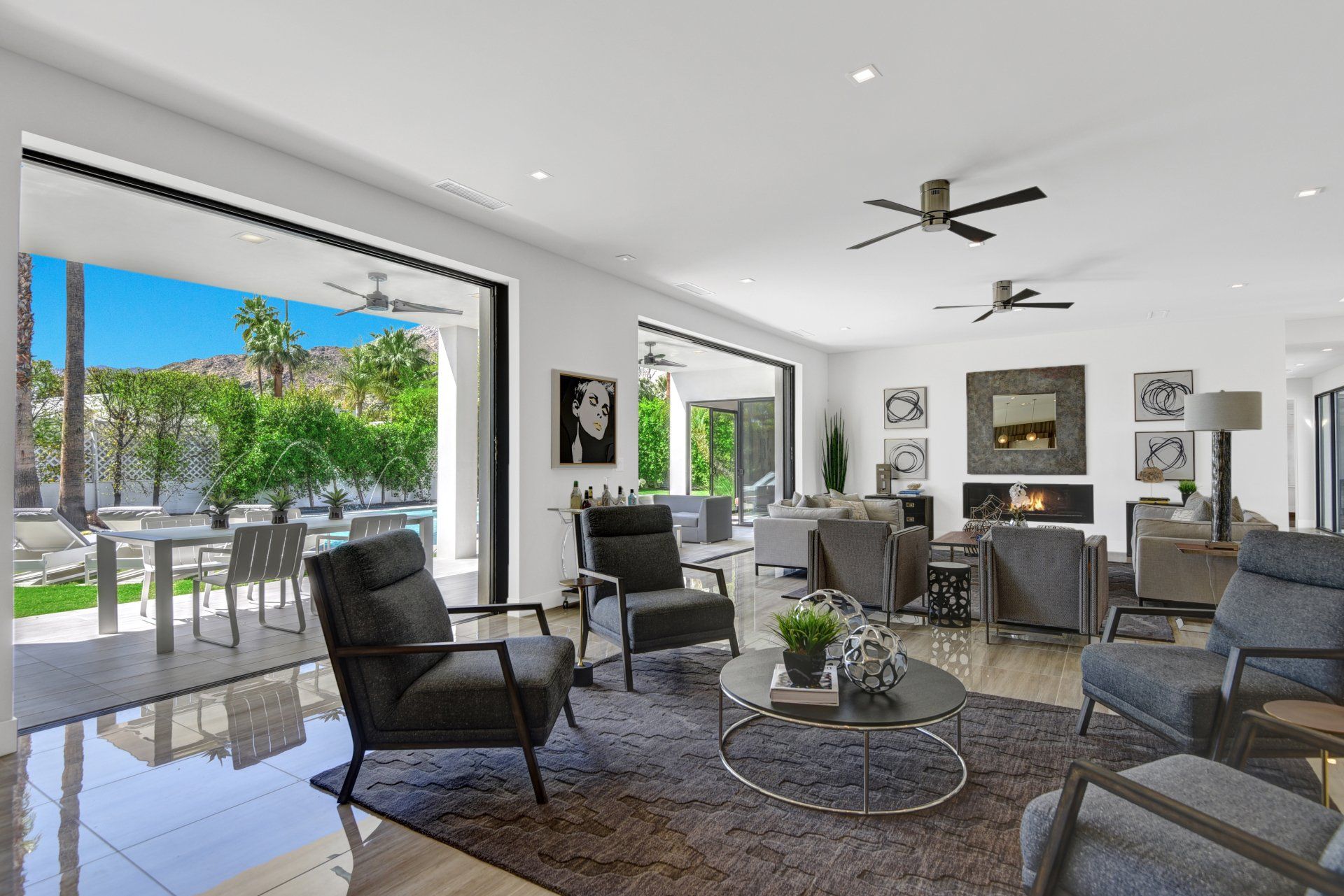 A living room filled with furniture and a ceiling fan.