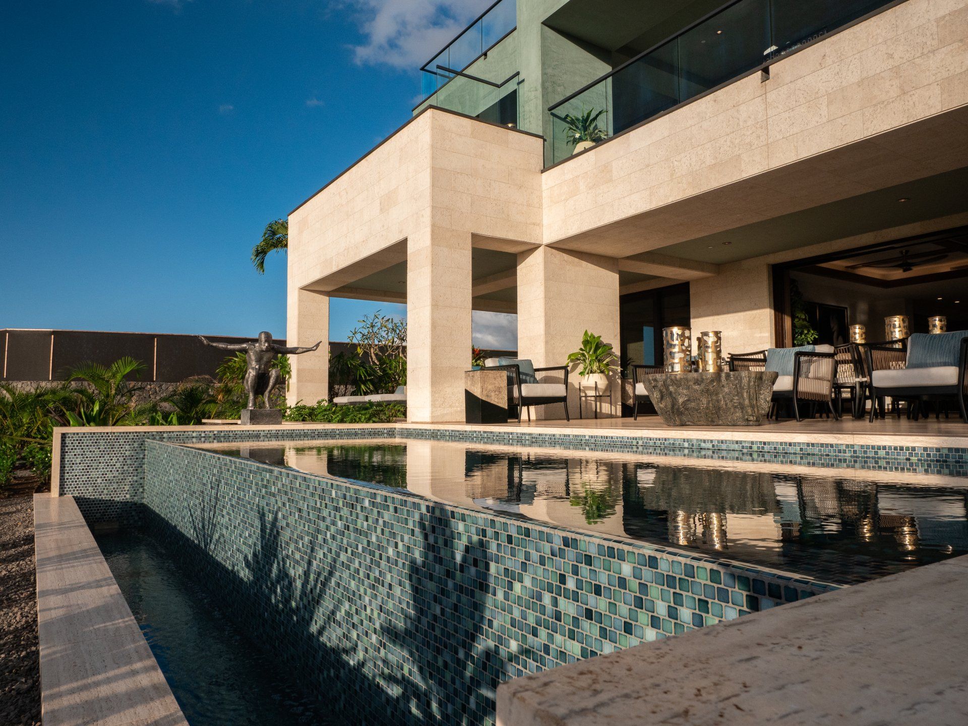 A large house with a swimming pool in front of it