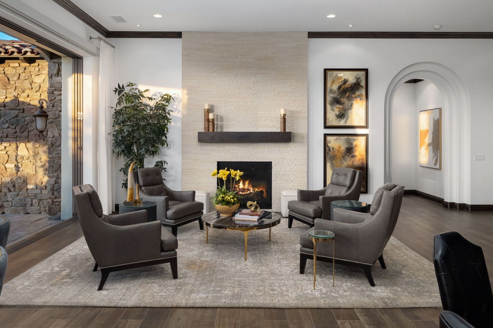 A living room filled with furniture and a fireplace.