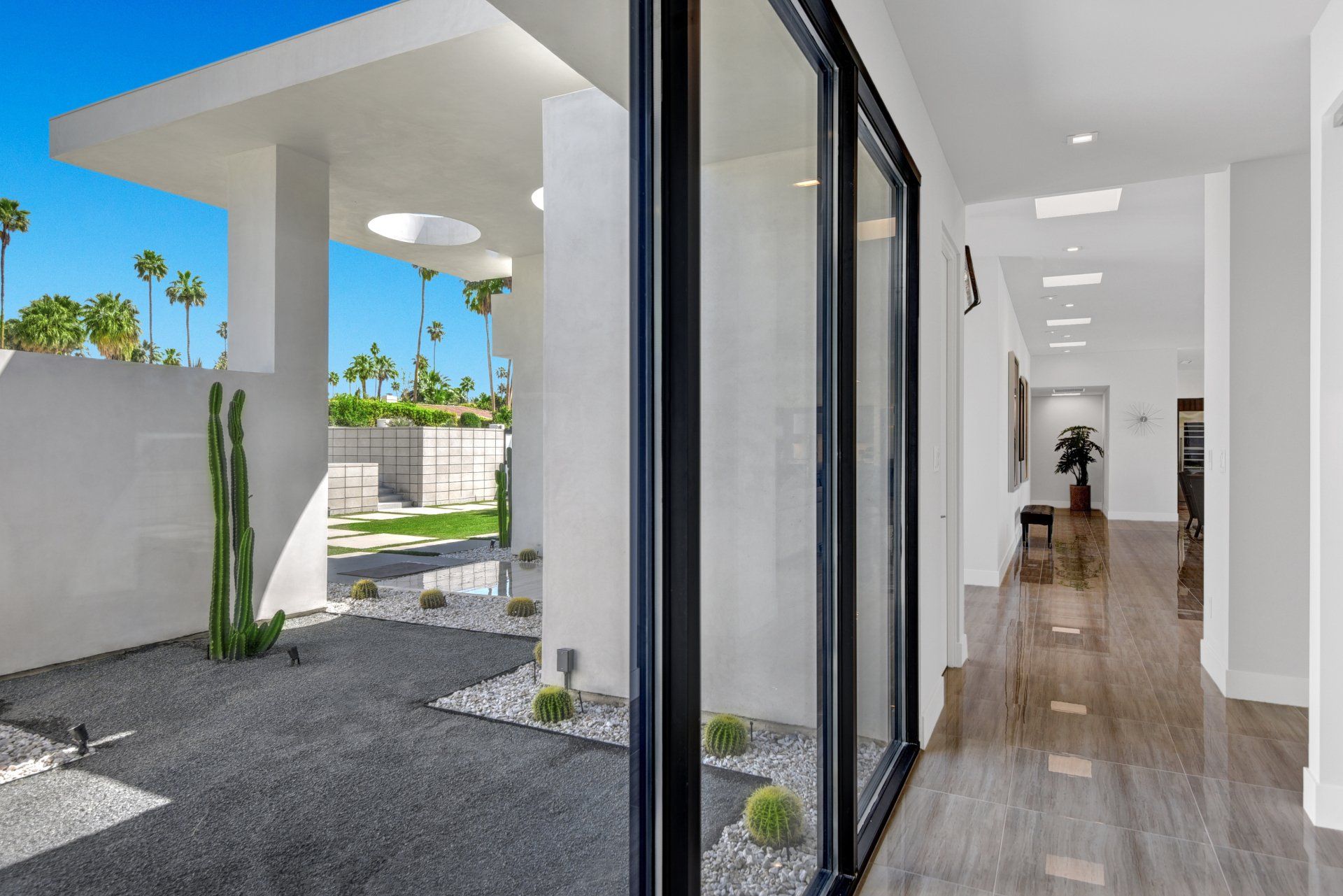 A hallway in a house with a sliding glass door